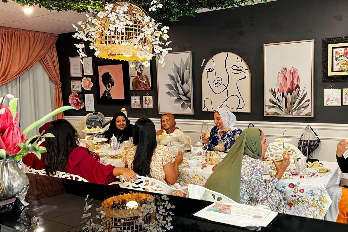 Groupo of women enjoying afternoon tea at a table